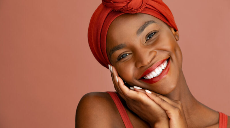 Beautiful stylish african woman smiling at camera